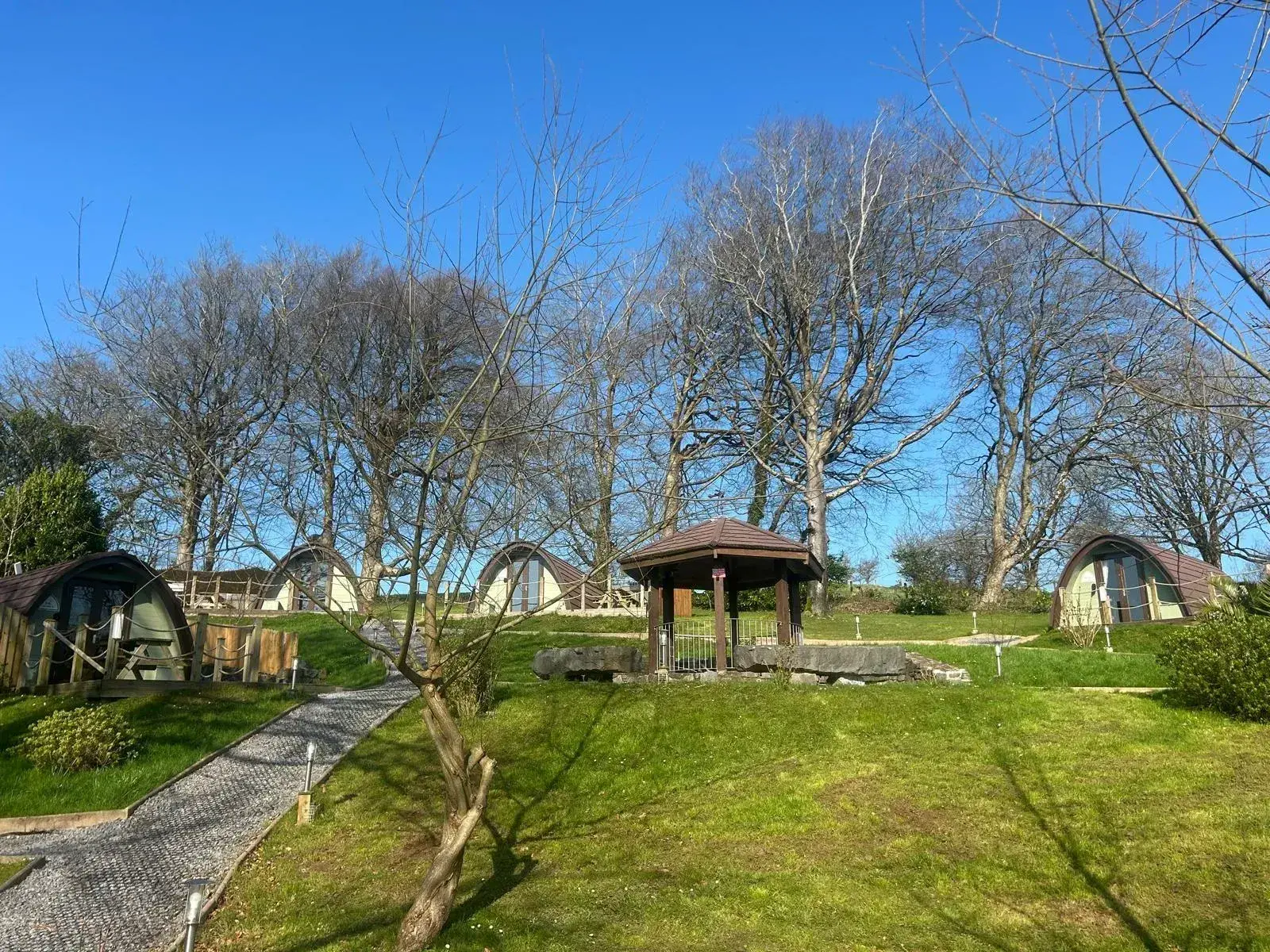 Pods @ Broadway grounds on a crisp spring day, pods dotted across the landscaped site