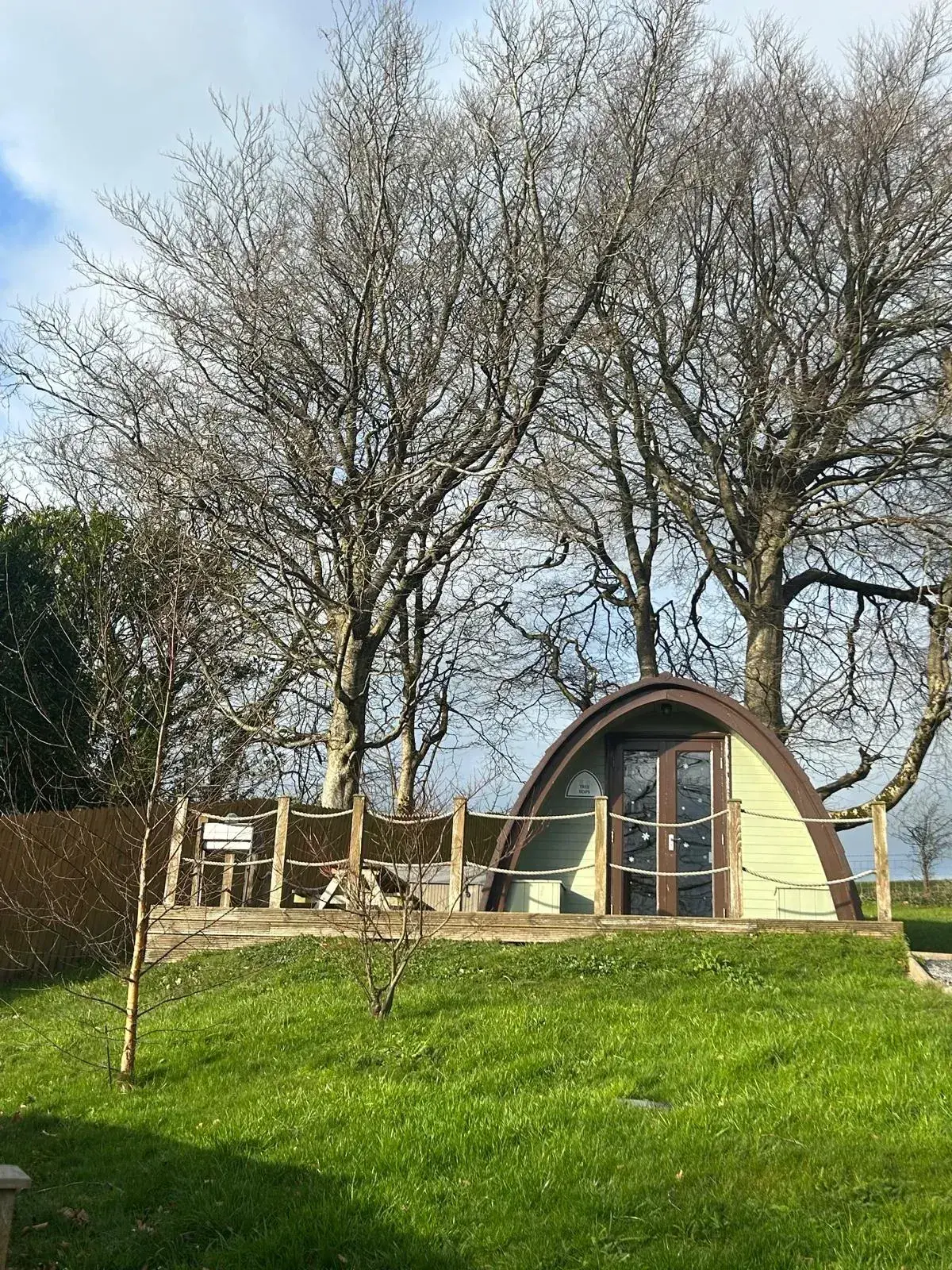 Jacuzzi Pod decorated for winter, with frosted window decals and its own private decking
